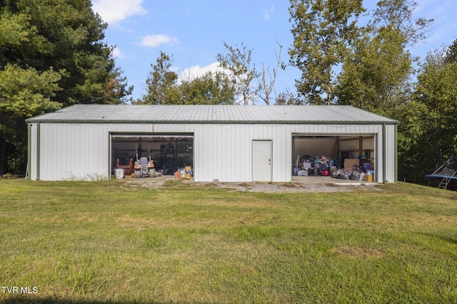 garage featuring a lawn