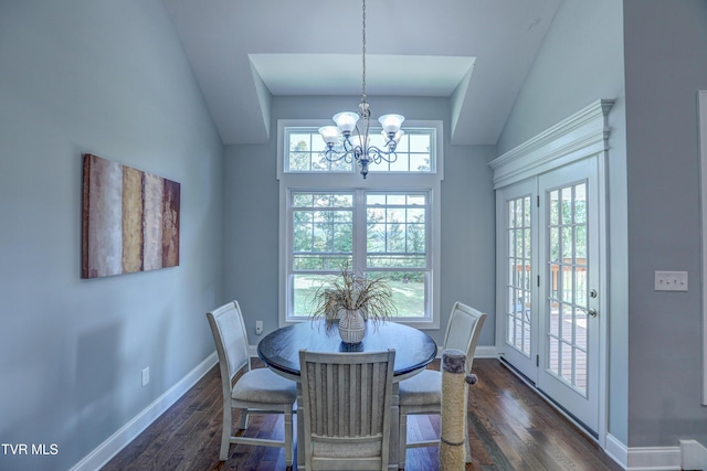 dining room featuring an inviting chandelier, dark hardwood / wood-style floors, and a high ceiling