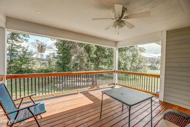 wooden deck with ceiling fan