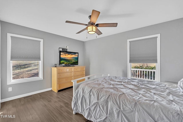 bedroom with dark wood-type flooring and ceiling fan