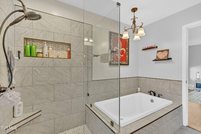 bathroom with shower with separate bathtub