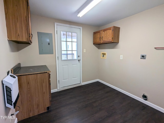 laundry area with hookup for an electric dryer, electric panel, dark wood-type flooring, cabinets, and washer hookup