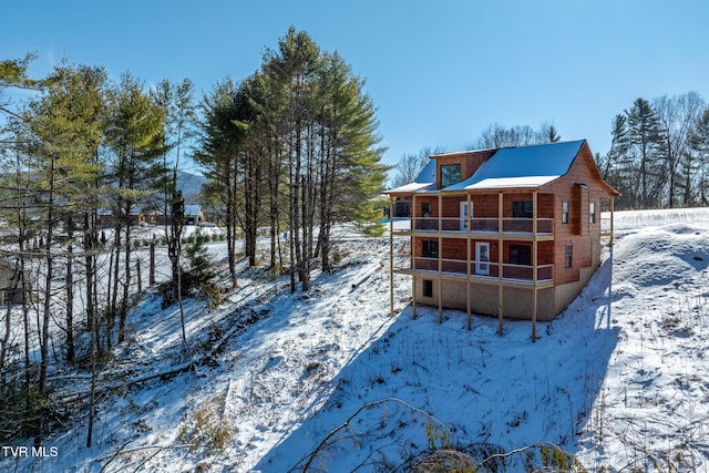 snow covered house with a balcony