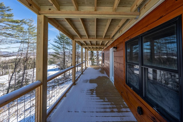 view of snow covered deck