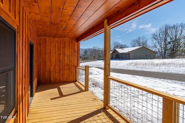 view of snow covered deck