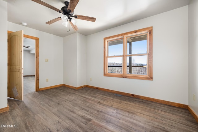 unfurnished room featuring hardwood / wood-style flooring and ceiling fan