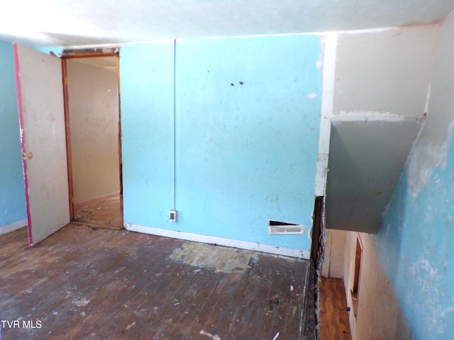 unfurnished room featuring dark hardwood / wood-style flooring