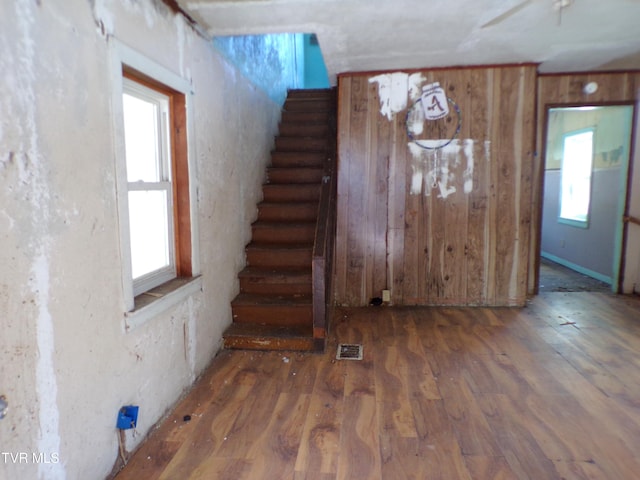 interior space with a healthy amount of sunlight and hardwood / wood-style floors