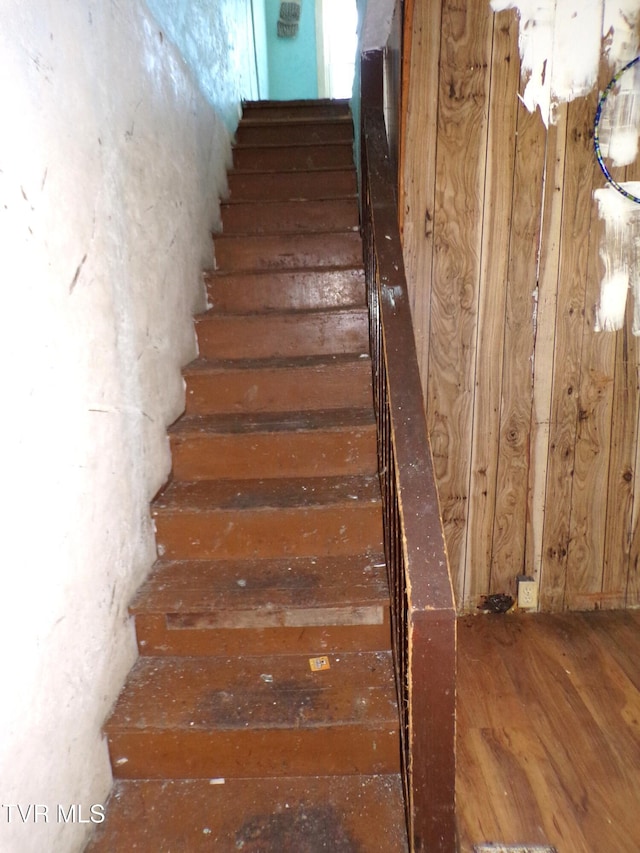 staircase featuring hardwood / wood-style flooring