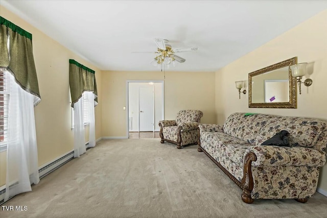 carpeted living room featuring ceiling fan, a healthy amount of sunlight, and baseboard heating