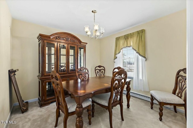 carpeted dining room with a chandelier