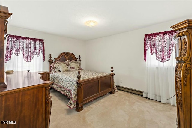 bedroom with light colored carpet and baseboard heating