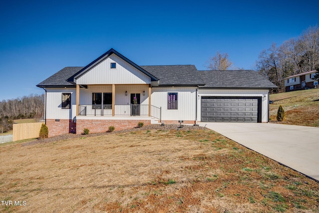 modern farmhouse style home with a garage, a front lawn, and covered porch