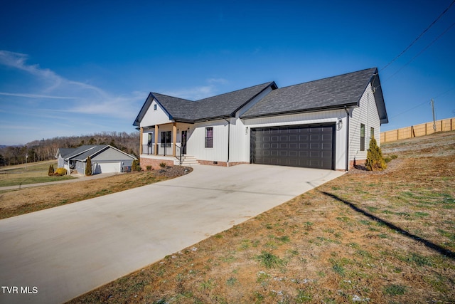 view of front of home featuring a garage, a front lawn, and covered porch