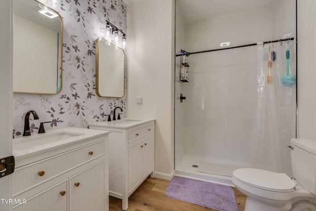 bathroom featuring vanity, toilet, hardwood / wood-style floors, and a shower with shower curtain