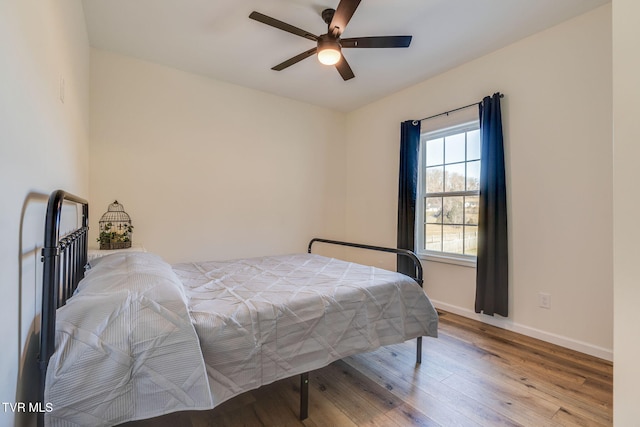 bedroom featuring light hardwood / wood-style flooring and ceiling fan