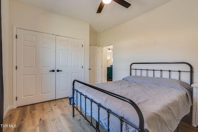 bedroom featuring light wood-type flooring, a closet, and ceiling fan