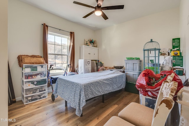 bedroom featuring ceiling fan and light hardwood / wood-style flooring