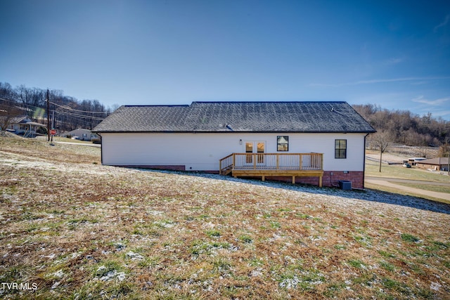 back of house with a wooden deck, central AC, and french doors