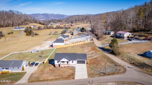 birds eye view of property featuring a mountain view