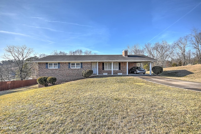 single story home featuring a front lawn and a carport