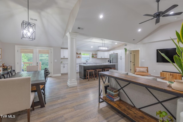 2912 W Walnut St, Johnson City, TN 37604 - living room with french doors, decorative columns, visible vents, recessed lighting, and light wood-style floors