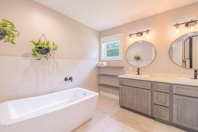 2912 W Walnut St, Johnson City, TN 37604 - full bathroom featuring double vanity, a freestanding bath, tile walls, and a sink