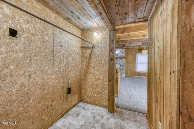 interior space featuring wooden walls and wood ceiling