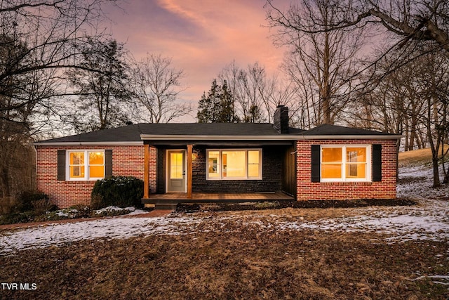 ranch-style house with covered porch