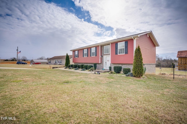 raised ranch featuring a front yard