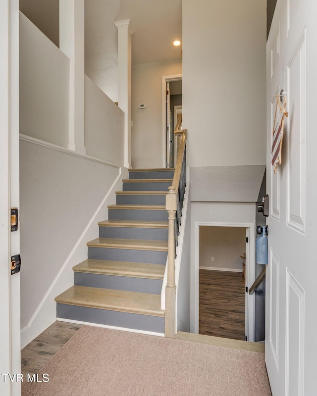 stairway with wood-type flooring