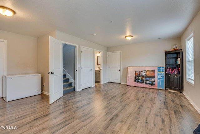 unfurnished living room featuring light hardwood / wood-style flooring