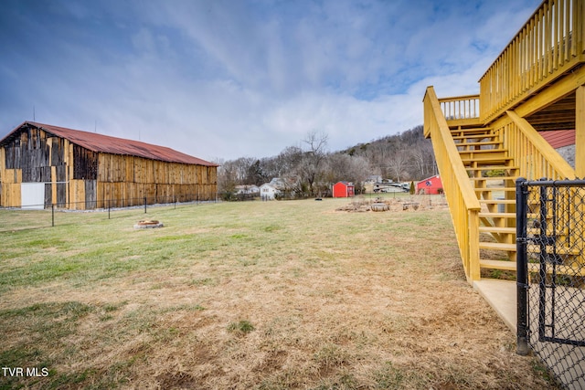 view of yard with an outbuilding and an outdoor fire pit