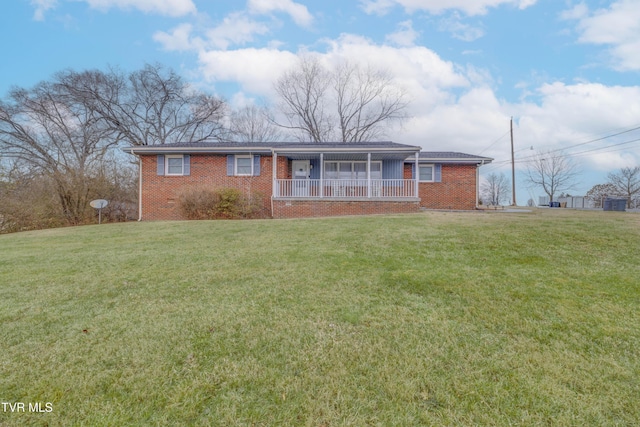 ranch-style house with a front lawn and a porch