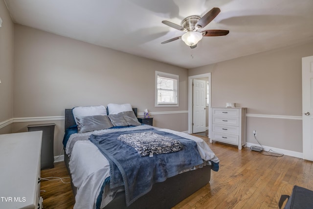 bedroom with hardwood / wood-style flooring and ceiling fan