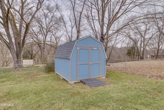 view of outbuilding with a lawn