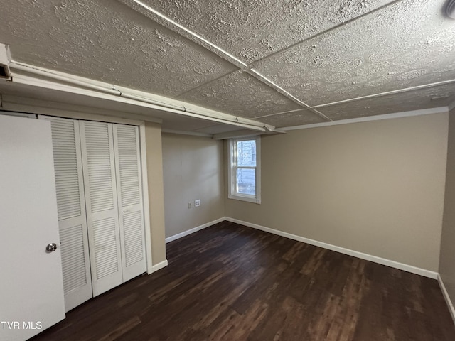 basement featuring dark hardwood / wood-style floors