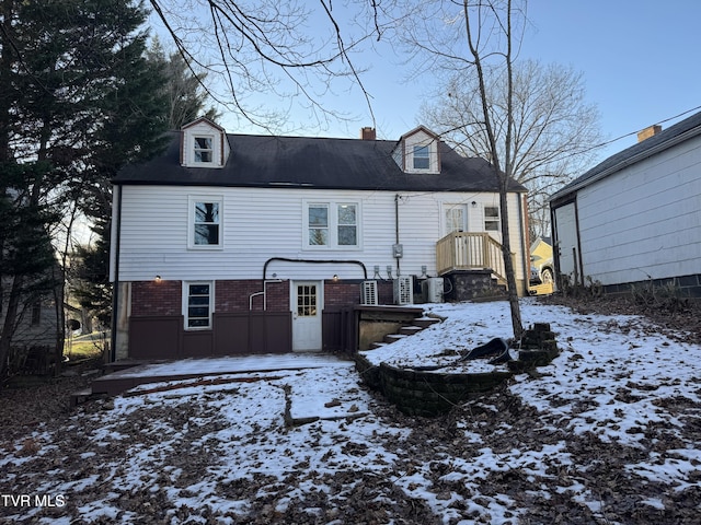 view of snow covered house