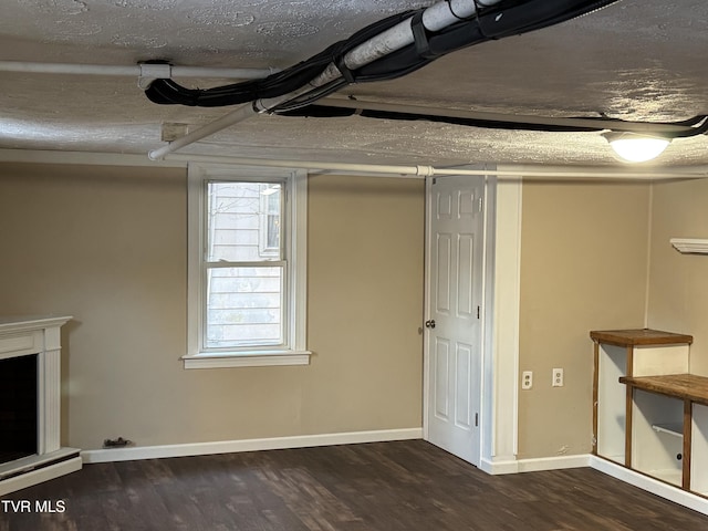 basement with dark wood-type flooring