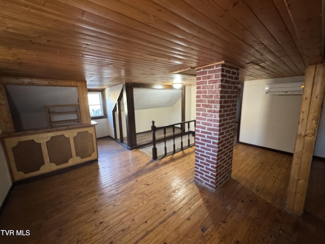 additional living space with wood ceiling, lofted ceiling, and wood-type flooring