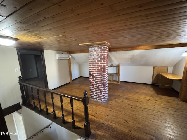 bonus room with wood ceiling, dark hardwood / wood-style floors, and an AC wall unit