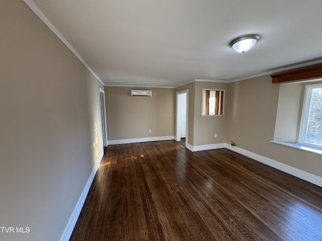 empty room with ornamental molding, dark wood-type flooring, and a wall unit AC