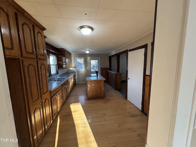 kitchen with a center island, sink, and dark hardwood / wood-style floors