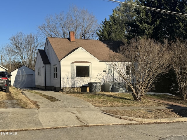 view of front of property featuring an outbuilding and a garage