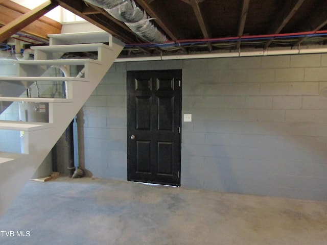 basement featuring concrete block wall
