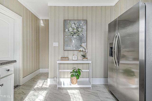 kitchen with stainless steel fridge with ice dispenser and white cabinets