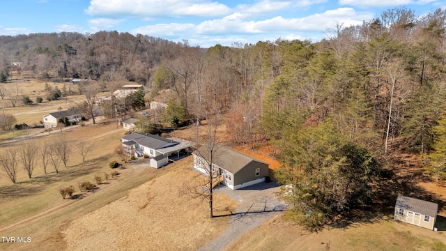 birds eye view of property with a rural view