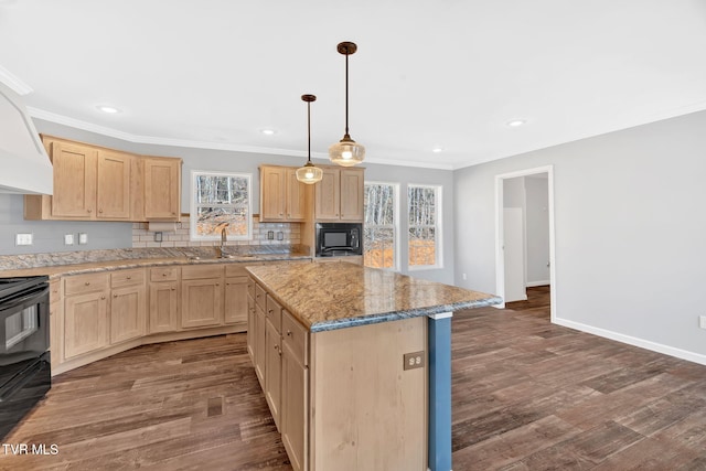 kitchen featuring a center island, dark wood-type flooring, black appliances, a healthy amount of sunlight, and light brown cabinets