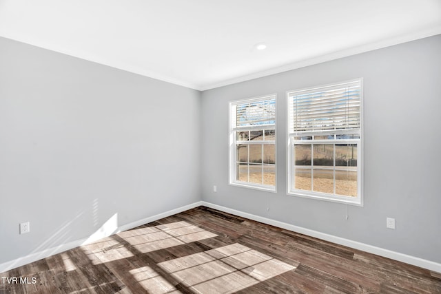 unfurnished room featuring ornamental molding and hardwood / wood-style floors