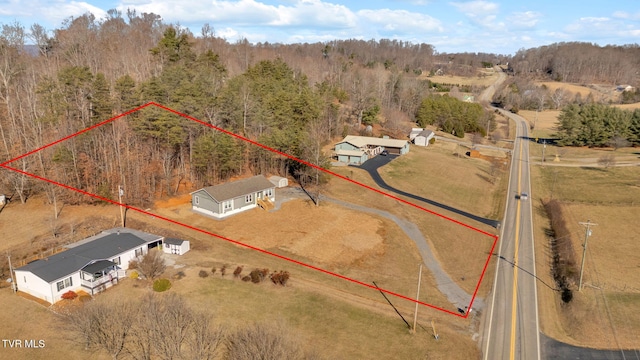 birds eye view of property featuring a rural view